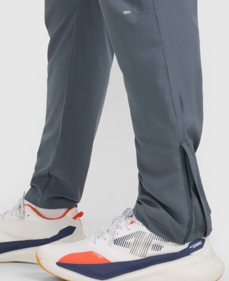 4F Akcia: Pánske rýchloschnúce bežecké nohavice TFTRM1253 grey